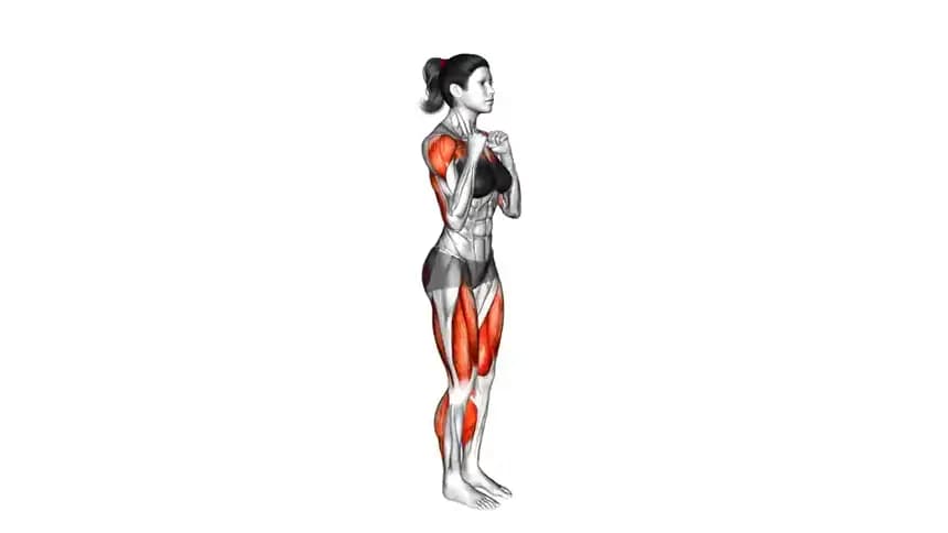 یک فرد در حال انجام حرکت مارچ با مشت، با بلند کردن زانوی راست و پرتاب مشت چپ به جلو در یک فضای ورزشی